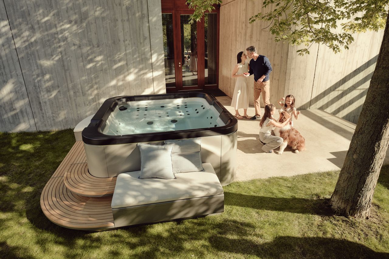 A family with their dog by the SP—116 in a sunlit garden