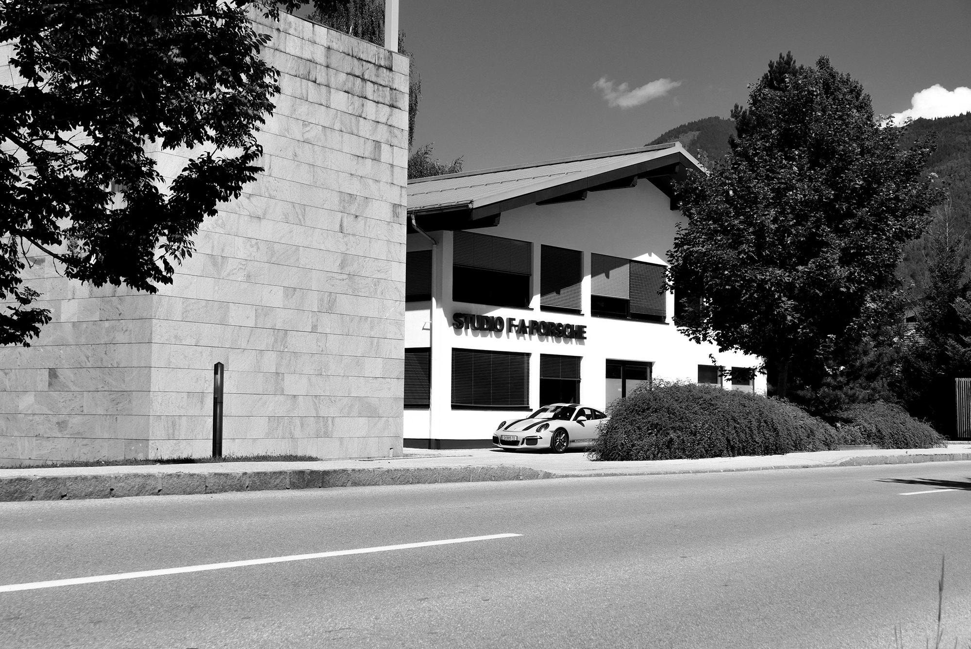 Studio F. A. Porsche headquarters in Zell am See, Austria, with a Porsche parked in front